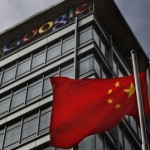 Chinese flag blows in air below Google